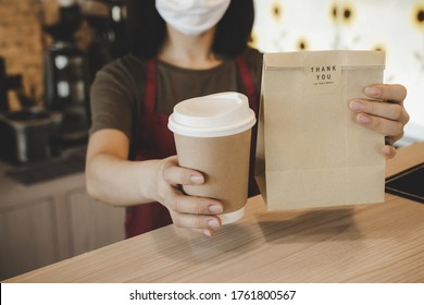 Waitress Wearing Protection Face Holding Hot Coffee Cup And Paper Bag Waiting For Customer In Modern Cafe Coffee Shop, Food Delivery, Cafe Restaurant, Takeaway Food, Small Business Owner Concept