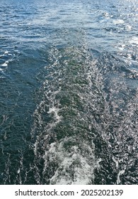 The Wake Behind A Sailboat