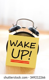 Wake Up Call Concept With Alarm Clock And Adhesive Note