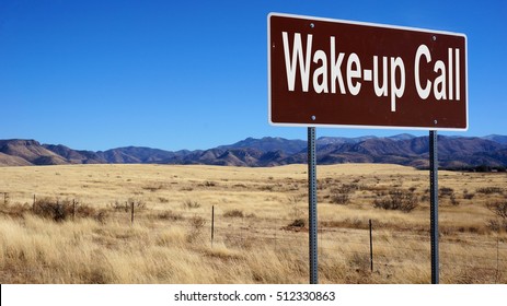 Wake Up Call Road Sign With Blue Sky And Wilderness