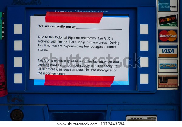 Wake Forest, NC United States- 05-12-2021:
A sign is displayed at an empty pump explaining the shortage caused
by the Colonial Pipeline cyber attack.
