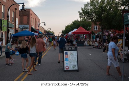 Wake Forest, NC/United States- 08/09/2019: Visitors To Downtown Wake Forest Enjoy Live Music During 