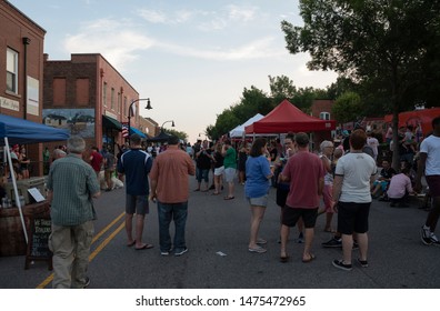 Wake Forest, NC/United States- 08/09/2019: Visitors To Downtown Wake Forest Enjoy Live Music During 