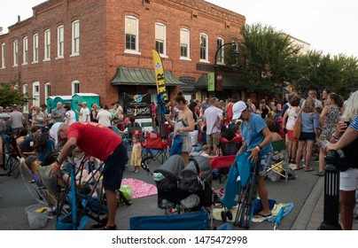 Wake Forest, NC/United States- 08/09/2019: Visitors To Downtown Wake Forest Enjoy Live Music During 