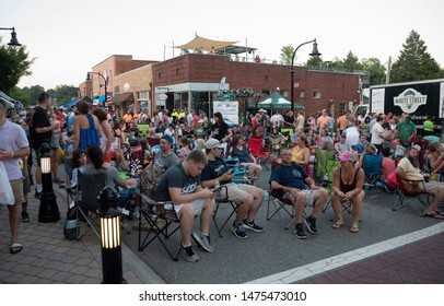 Wake Forest, NC/United States- 08/09/2019: Visitors To Downtown Wake Forest Enjoy Live Music During 