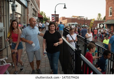 Wake Forest, NC/United States- 08/09/2019: Visitors To Downtown Wake Forest Enjoy Live Music During A 