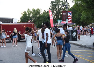 Wake Forest, NC/United States- 08/09/2019: Visitors To Downtown Wake Forest Enjoy Live Music At A 