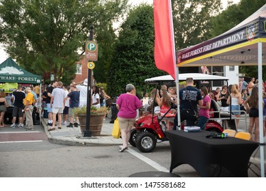 Wake Forest, NC/United States- 08/09/2019: Visitors To Downtown Wake Forest Enjoy Live Music At A 