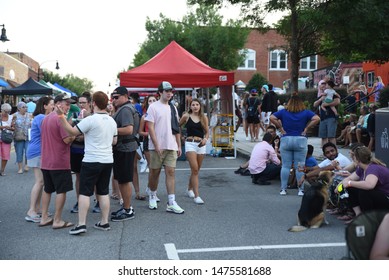 Wake Forest, NC/United States- 08/09/2019: Visitors To Downtown Wake Forest Enjoy Live Music At A 