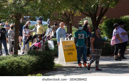 Wake Forest, NC/United States- 10/15/2020: A diverse group of North Carolina voters stand in very long lines on the first day of early voting.