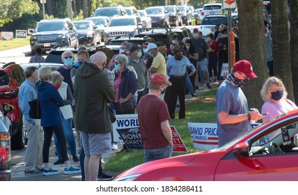 Wake Forest, NC/United States- 10/15/2020: North Carolina voters stand in very long lines to cast their ballots on the first day of early voting.