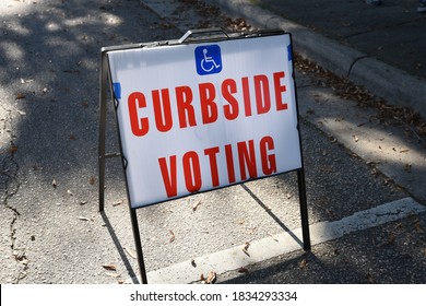 Wake Forest, NC/United States- 10/15/2020: A curbside voting sign is displayed outside a polling location.