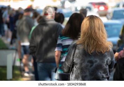 Wake Forest, NC/United States- 10/15/2020: A Caucasian Woman Waits In A Long Line On The First Day Of Early Voting In North Carolina.