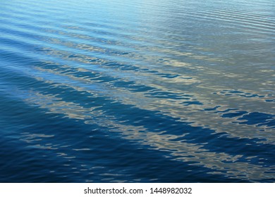 Wake Ripples In Sea Water Surface