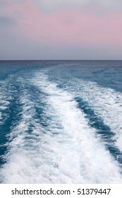 Wake Of A Ship Background; Soft Pinkish Sunset Sky