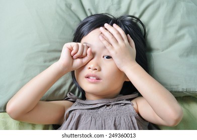 wake up of sleepy asian little child in the top view - Shutterstock ID 249360013