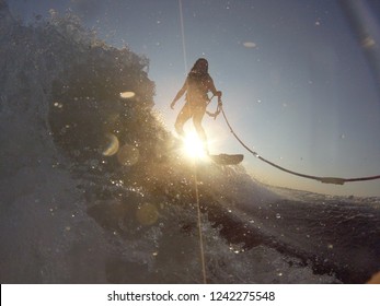 Wake Surfing Photo In Front Of A Sunset In Gorgeous Cottage Country In Quebec, Canada.  Captured With A GoPro Hero 6