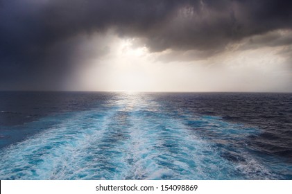 Wake Of Water Seen From Behind The Boat On A Stormy Night