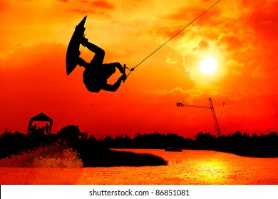 Wakeboarding Action Man Surf And Jump To  Beautiful Sky Silhouetted , Extreme Sport