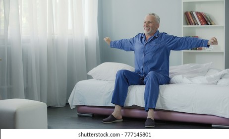 Waking up full of energy cheerful pensioner doing morning gymnastics, new day