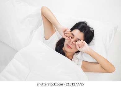 Waking Up With A Headache. Beautiful Woman Can't Fall Asleep, Moving Restless On Bed. Young Woman Having Bad Dream, Sleep Troubles Trying Can Not Sleep.