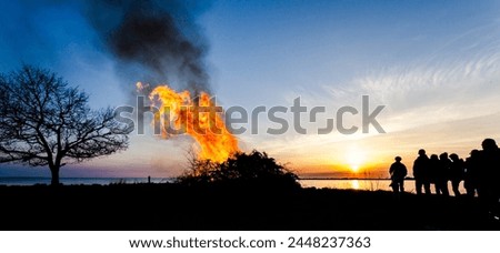 Walburg celebrating spring bonfire Sweden silhuett people
