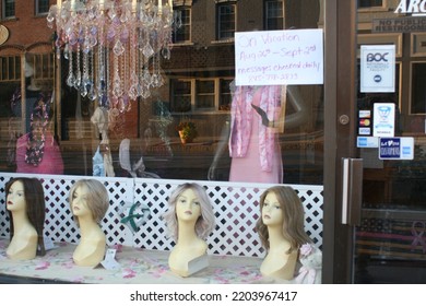 Walden, New York USA - August 31st 2022 - Street Scene, Mannequin Heads In Store Window, Reflection Of Buildings Across The Street. 