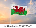 Wales flag waving on sundown sky