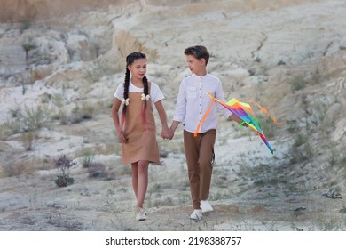 Walk Of Children 8-9 Years Old With Kite In The Mountains.