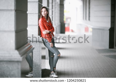 Similar – Schöne junge Frau auf der Parkbank sitzend