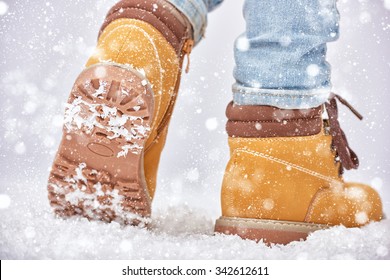 a walk in the snow. closeup of winter shoes.