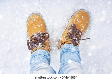 a walk in the snow. closeup of winter shoes.