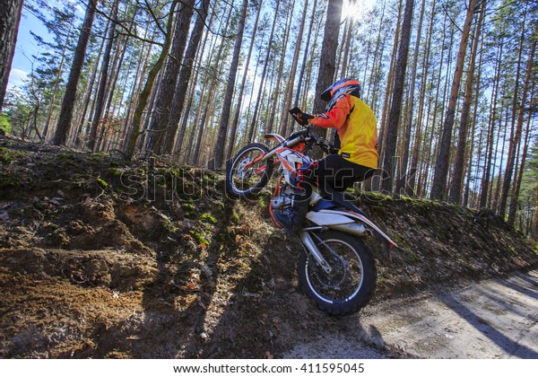 Walk at a sports bike (brand KTM freeride\
350) in the forest. Man in a sports bike on a forest background. 20\
April 2016 year. Ukraine Kiev.\
Editorial