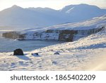 Walk through the frozen landscape during sunset. Iceland, Troll Peninsula