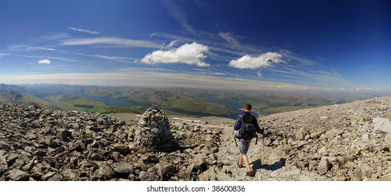 Walker Descending Ben Nevis On A Clear Summer Day