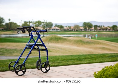Walker Outdoors on Patio With Golf Course In Background