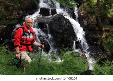 Walker at a waterfall