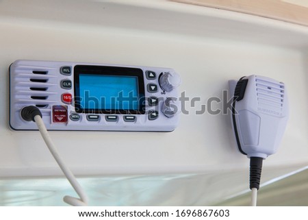 Walkie-talkie in the control cabin of a motor yacht. Radio station on a yacht.