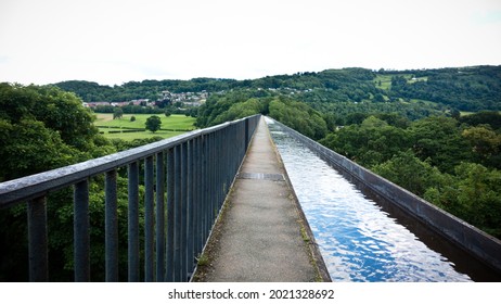 Walking along Pontcysyllte Aqueduct with canal. It is the highest canal aqueduct in the world. Landscpe orientation photo.