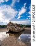 walking around an old ship wreck of City Dulas Anglesey