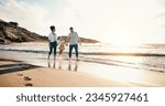 Walking, bonding and family on the beach for vacation, adventure or holiday together at sunset. Travel, having fun and girl child with her mother and father on the sand by the ocean on weekend trip.