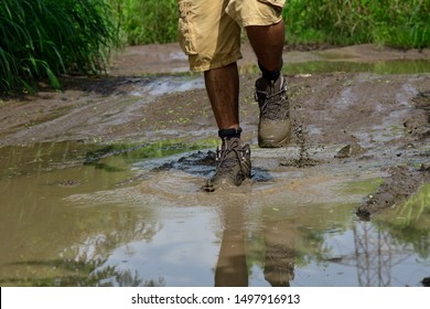 Walking with boots through a puddle