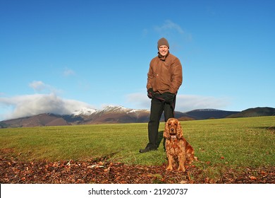 Walking in The breath taking Lake District at Derwentwater Lakeside near Keswick, England  during December with snow capped mountains in background - Powered by Shutterstock