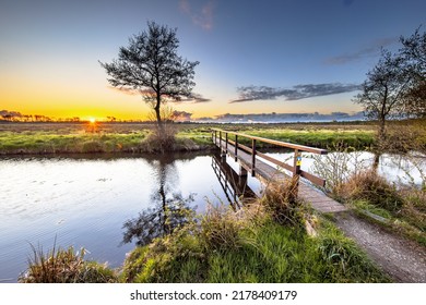 Walking bridge crossing river in dutch countryside National Park landscape the Drentsche Aa, Drenthe Province, the Netherlands - Powered by Shutterstock