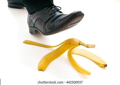 Walking Businessman Is Going To Slip On Banana Peel.