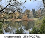 Walking by Harewood house lake in autumn