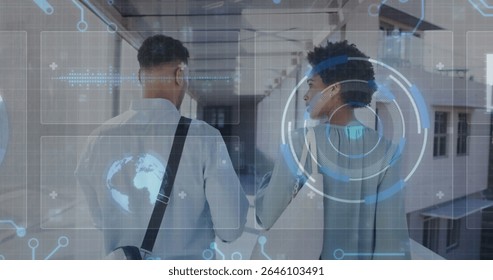 Walking colleagues carrying bag and exploring glass windowed corridor, with holographic interface. Modern, technology, collaboration, innovation, corporate, futuristic, networking