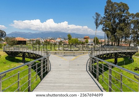 Walking deck in the botanical garden of Cuenca. Panoramic view of the city and the Andes mountains in the background. Sunny day. Ecuador