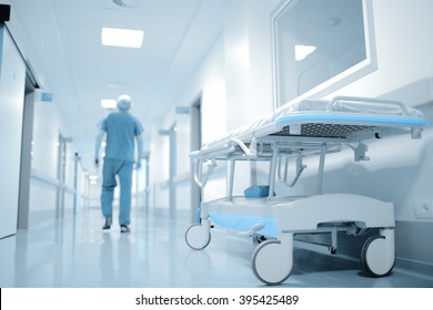 Walking Doctor On The Long Way In Hospital Department.