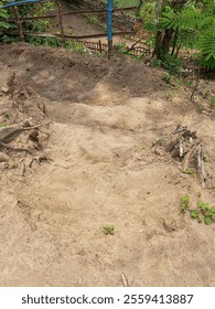 walking down the steps made of earth that has been crushed for crossing purposes.